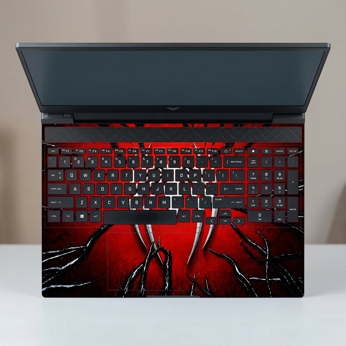 Metallic Spider Emblem In Crimson Cracks Laptop Skin